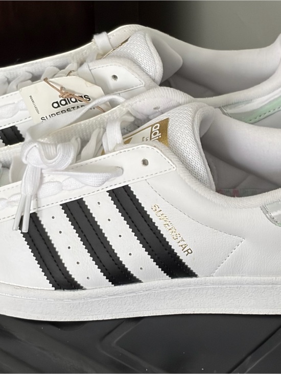 adidas Shoes - adidas White & Black Low-Top Sneakers with Gold Accents
